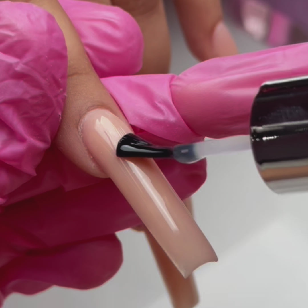 A close-up of nails styled with Cover Natural Nude, showcasing the flawless, natural nude shade and luxurious finish.