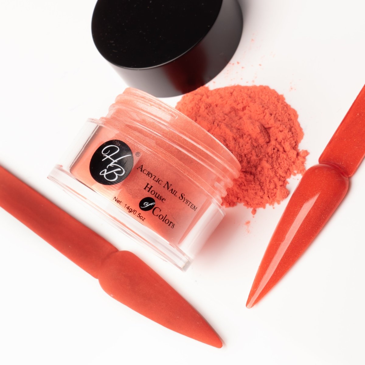 Close-up of Texas Sunset Acrylic Powder, showcasing its rich burnt orange color with subtle shimmer, emphasizing the fine, smooth texture of the powder.