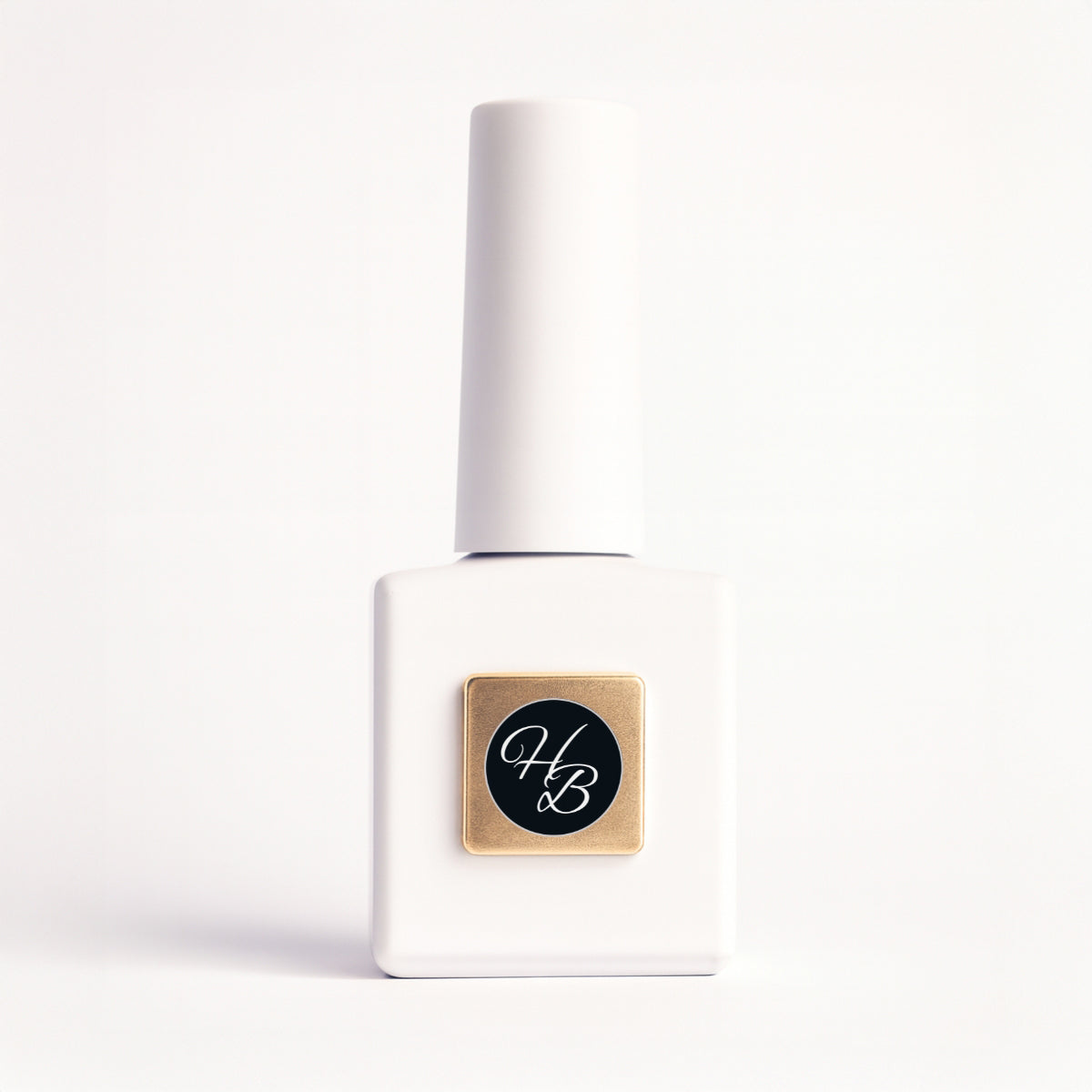 White nail polish bottle with gold and black label on a white background